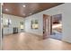 Open living space with wood floors and kitchen access at 1337 Fairfield Dr, Lilburn, GA 30047
