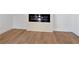 Living room featuring a modern electric fireplace and light wood floors at 1337 Fairfield Dr, Lilburn, GA 30047