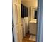 Bathroom featuring a vanity, a mirror, a toilet, and a shower/tub with a striped curtain at 4876 Velva Nw Way, Lilburn, GA 30047