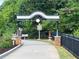 The Greenway Trail entrance is marked by an attractive gateway, perfect for walking and biking at 4876 Velva Nw Way, Lilburn, GA 30047
