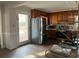 Kitchen with stainless steel appliances, wood cabinets, tile backsplash, and hardwood floors at 4876 Velva Nw Way, Lilburn, GA 30047