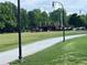 Scenic community park view with paved path, pavilion, and open green space at 4876 Velva Nw Way, Lilburn, GA 30047