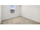 Upstairs bedroom with window and carpet at 2448 Lenox Se Rd, Conyers, GA 30094