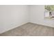 Upstairs bedroom with neutral carpet and window at 2448 Lenox Se Rd, Conyers, GA 30094