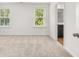Bright bedroom with neutral carpet and access to a bathroom at 2448 Lenox Se Rd, Conyers, GA 30094