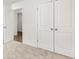 Upstairs bedroom with double doors and closet at 2448 Lenox Se Rd, Conyers, GA 30094