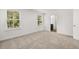 Spacious bedroom with neutral carpet and two windows at 2448 Lenox Se Rd, Conyers, GA 30094