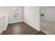 Upstairs bedroom with wood-look flooring and window at 2448 Lenox Se Rd, Conyers, GA 30094