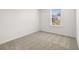 Bright bedroom with carpet flooring and a window offering natural light at 2448 Lenox Se Rd, Conyers, GA 30094