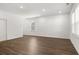 Spacious bonus room with wood-look floors and large windows at 2448 Lenox Se Rd, Conyers, GA 30094