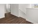 Upstairs hallway with wood-look flooring at 2448 Lenox Se Rd, Conyers, GA 30094