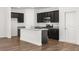 Eat-in kitchen with granite countertops and stainless steel appliances at 2448 Lenox Se Rd, Conyers, GA 30094
