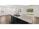 Eat-in kitchen with granite countertops and stainless steel appliances at 2448 Lenox Se Rd, Conyers, GA 30094