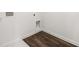 Laundry area with dark wood-look flooring and a utility access at 2448 Lenox Se Rd, Conyers, GA 30094