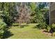 Landscaped backyard with mature trees at 1452 Merriman Ne Ln, Atlanta, GA 30324