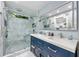 Modern bathroom with double vanity, walk-in shower, and marble tile at 1452 Merriman Ne Ln, Atlanta, GA 30324