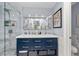 Modern bathroom with double vanity, walk-in shower, and marble tile at 1452 Merriman Ne Ln, Atlanta, GA 30324