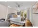 Bedroom with hardwood floors, patio access, and built-in closet at 1452 Merriman Ne Ln, Atlanta, GA 30324