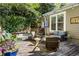 Relaxing deck with hot tub, seating area, and lush greenery at 1452 Merriman Ne Ln, Atlanta, GA 30324