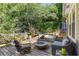 Deck with hot tub, fire pit, and comfortable seating at 1452 Merriman Ne Ln, Atlanta, GA 30324
