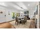 Bright dining room featuring hardwood floors and a glass table at 1452 Merriman Ne Ln, Atlanta, GA 30324