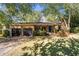 Stone house with a two-car garage and a large front yard at 1452 Merriman Ne Ln, Atlanta, GA 30324