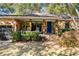 Stone house with a covered porch and a blue front door at 1452 Merriman Ne Ln, Atlanta, GA 30324