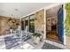 Covered porch with rocking chairs and entry to the home at 1452 Merriman Ne Ln, Atlanta, GA 30324
