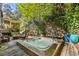 Enjoy this hot tub on a deck surrounded by lush landscaping at 1452 Merriman Ne Ln, Atlanta, GA 30324