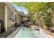 Relax on this deck featuring a hot tub, fire pit, and ample seating at 1452 Merriman Ne Ln, Atlanta, GA 30324