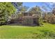 Back exterior view of house showing deck and yard at 1452 Merriman Ne Ln, Atlanta, GA 30324