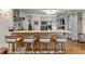 Eat-in kitchen with wood and white quartz island and four stools at 1452 Merriman Ne Ln, Atlanta, GA 30324
