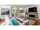 Spacious living room with hardwood floors, fireplace, and french doors at 1452 Merriman Ne Ln, Atlanta, GA 30324