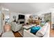 Spacious living area with hardwood floors, fireplace, and open kitchen at 1452 Merriman Ne Ln, Atlanta, GA 30324