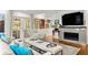 Spacious living room with hardwood floors, fireplace, and french doors at 1452 Merriman Ne Ln, Atlanta, GA 30324