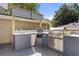 Outdoor kitchen with grill, sink, and ample counter space at 1452 Merriman Ne Ln, Atlanta, GA 30324