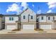 Charming townhome exterior featuring a brick facade, neutral siding, and a convenient one-car garage at 320 Shine Dr, Stockbridge, GA 30281