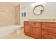 Bathroom featuring vanity with granite countertops, tub and tiled shower at 1195 Fielding Way, Marietta, GA 30068