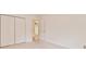 Bedroom with plush carpeting, double closets, and adjacent hallway access at 1195 Fielding Way, Marietta, GA 30068