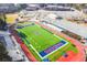 Aerial view of a well-manicured football field with vibrant green turf, clear markings, and surrounding track at 1195 Fielding Way, Marietta, GA 30068