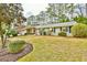 Well-maintained front yard showcasing the home's facade, including lush landscaping and mature trees at 1195 Fielding Way, Marietta, GA 30068