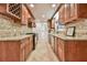 The kitchen features stainless steel appliances, granite countertops, and tile floors at 1195 Fielding Way, Marietta, GA 30068