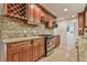 Kitchen features granite countertops, stainless steel appliances, and a wine rack at 1195 Fielding Way, Marietta, GA 30068