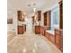 This kitchen has tile floors, granite countertops, and wood cabinets at 1195 Fielding Way, Marietta, GA 30068