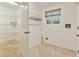 A spacious laundry room features tile floors and wire shelving at 1195 Fielding Way, Marietta, GA 30068
