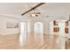 Bright living room features hardwood floors, a ceiling fan, and access to the kitchen at 1195 Fielding Way, Marietta, GA 30068