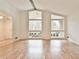 Living room featuring hardwood floors and large windows bringing in natural light at 1195 Fielding Way, Marietta, GA 30068