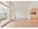 Light-filled living room featuring hardwood floors and large picture windows overlooking the yard at 1195 Fielding Way, Marietta, GA 30068