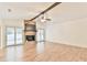 Living room with stone fireplace, wood beam and sliding glass doors at 1195 Fielding Way, Marietta, GA 30068