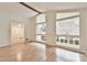 Bright living room with hardwood floors, large windows, and vaulted ceilings at 1195 Fielding Way, Marietta, GA 30068